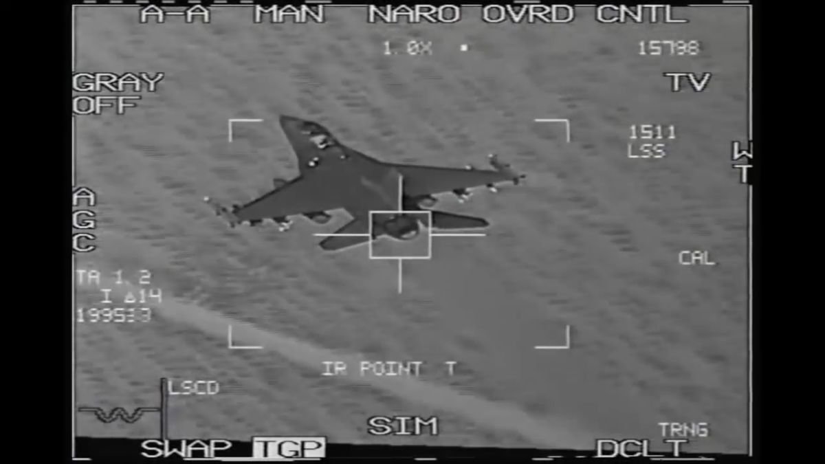 Sensor view from a Gungnir-equivalent EO/IR turret: a fighter aircraft framed inside a tracking reticle, with telemetry overlays surrounding the frame.